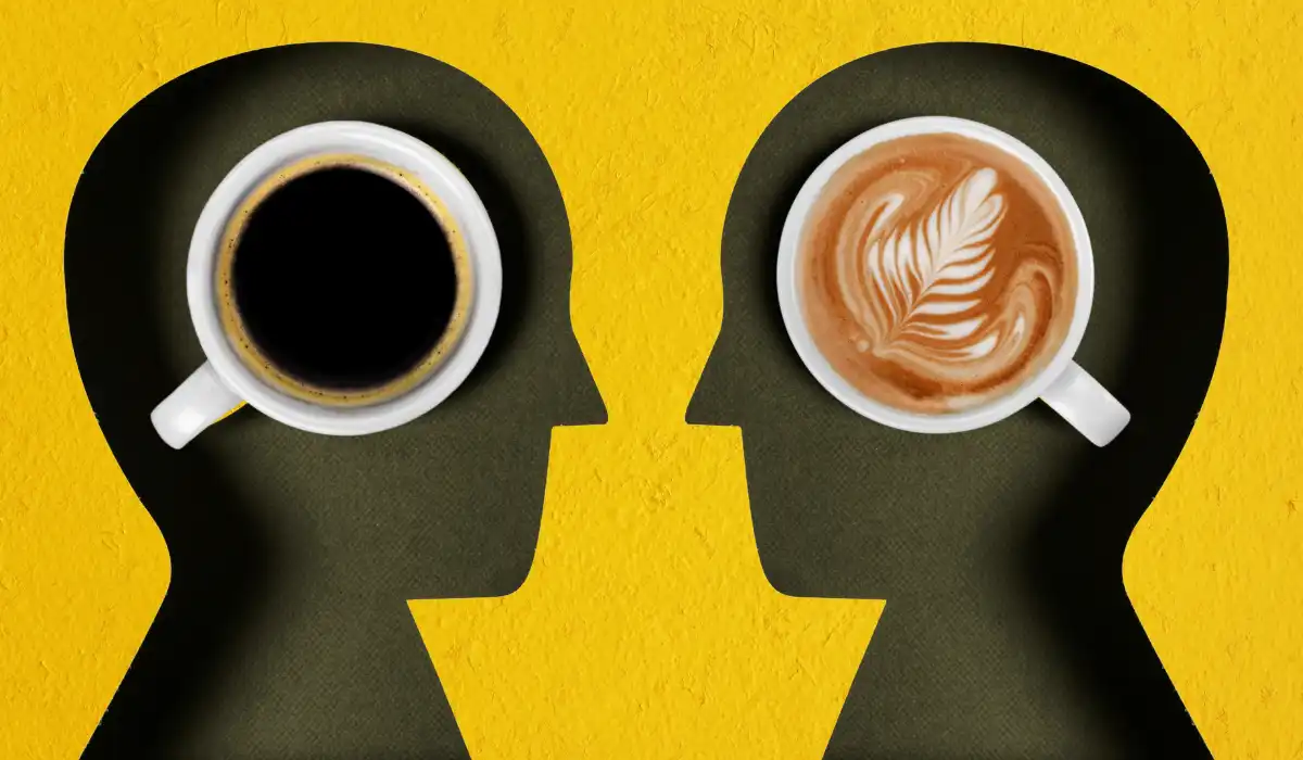 coffee mugs placed on cut out of two people facing each other on a yellow background