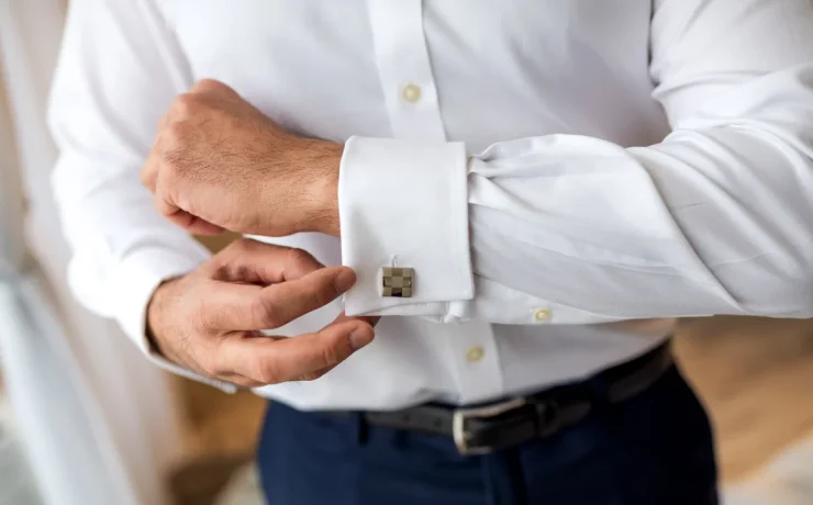 a person adjusting sleeve