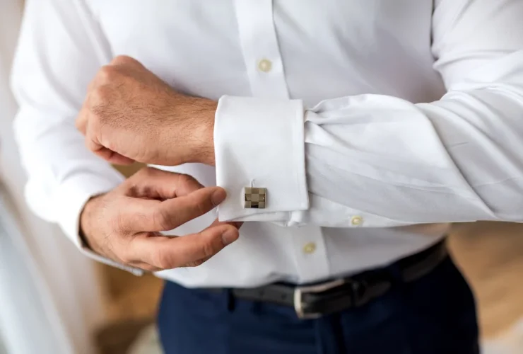 a person adjusting sleeve