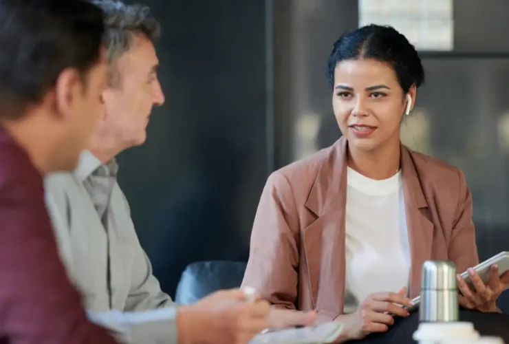 A consultant advising top executives in an office.