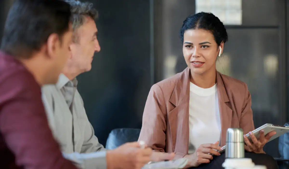 A consultant advising top executives in an office.