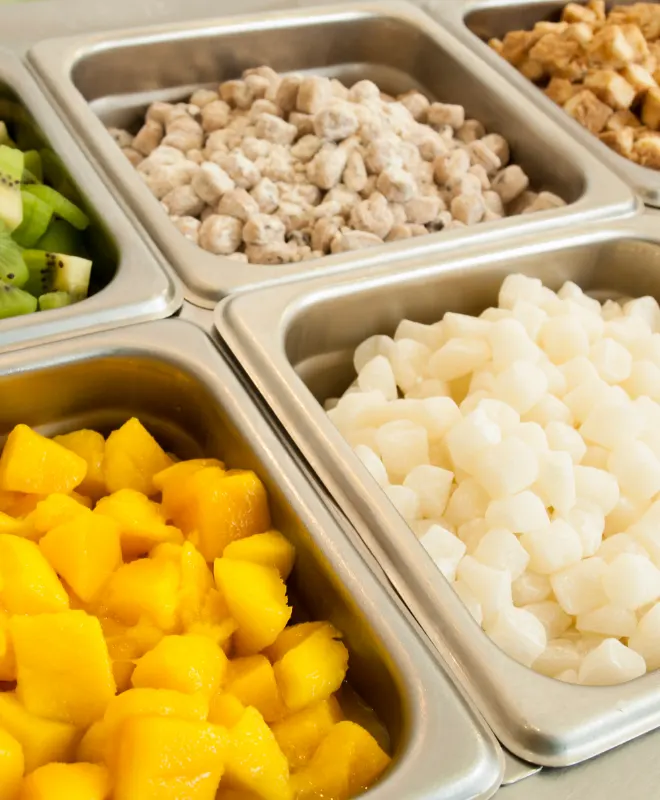chopped veggies stored in steel containers in a quick service restaurant