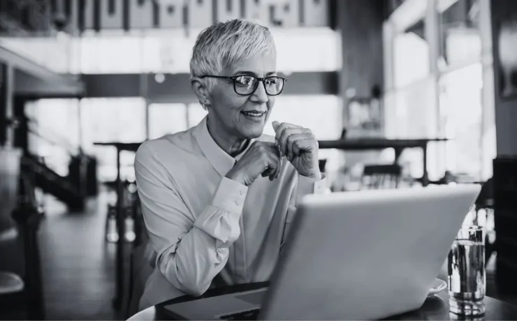 ceo using a laptop on an office desk.