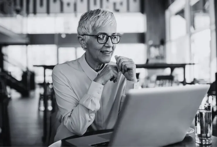 ceo using a laptop on an office desk.