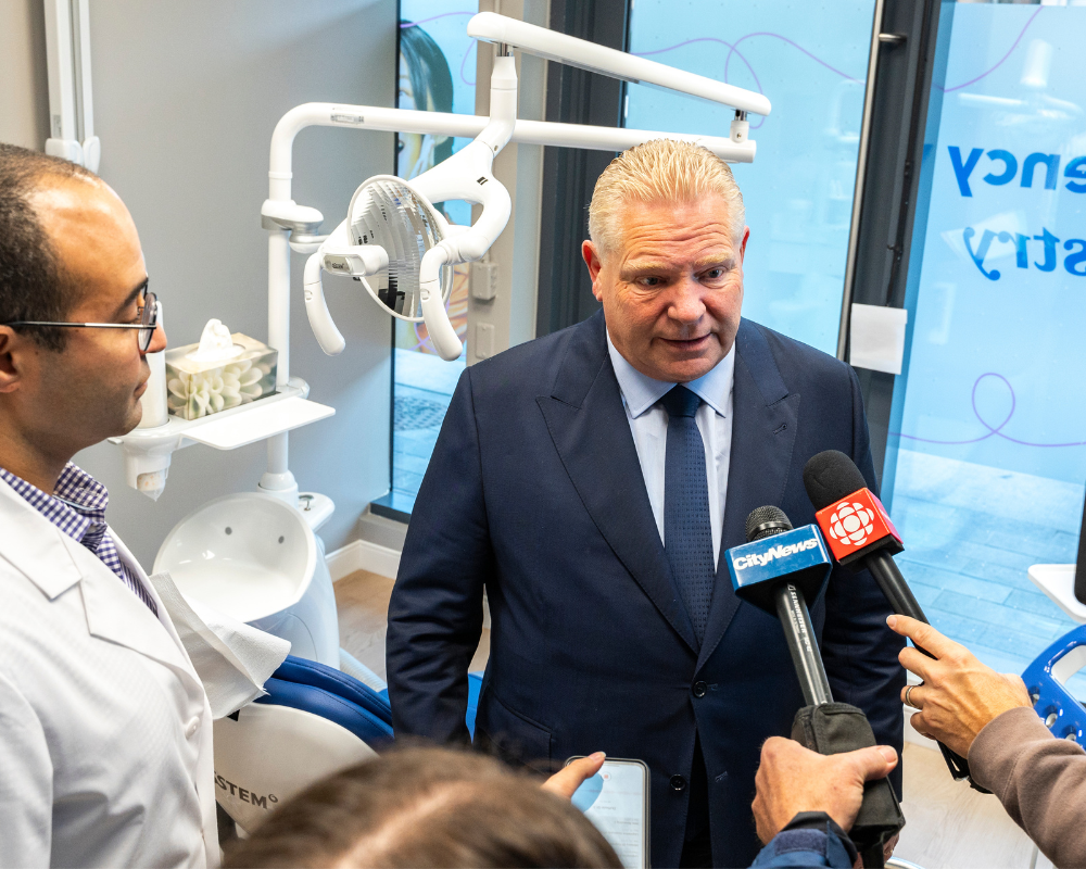 a dog sitting on a table at the vet